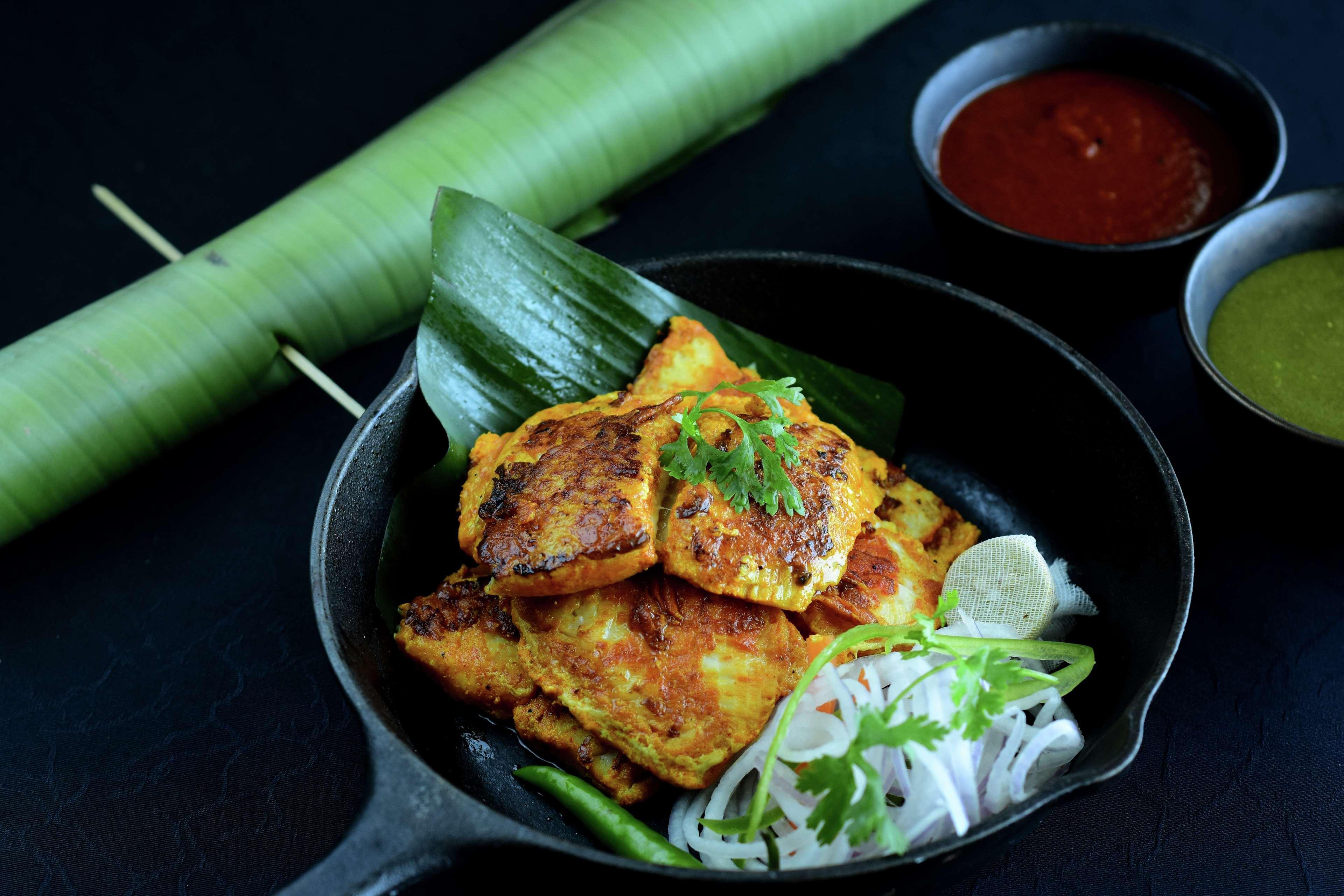 Hilton Mumbai International Airport Hotel Kültér fotó A plate of opek